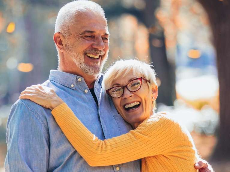 couple smiling while hugging