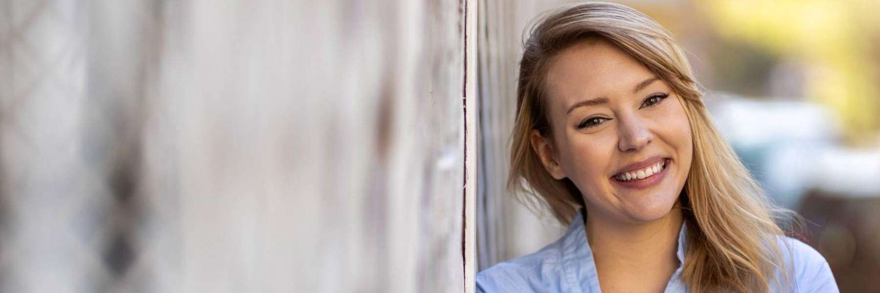 woman with a blonde hair smiling